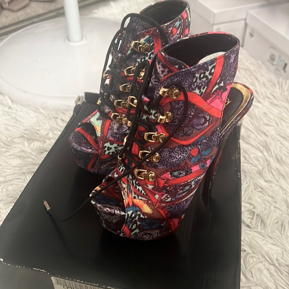 Laced up heels .. Never worn .. still like brand new . Too small for me now.